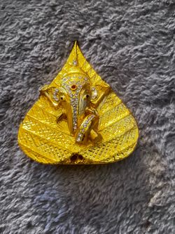 STONE STUDDED AND GOLD PLATED GANESHA ON LEAF