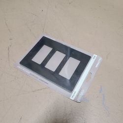 Lutron Claro 3-Gang And 1-Gang Screwless Wall Plate in a gloss black finish. 