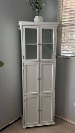 Tall white storage cabinet