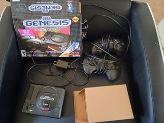 Sega genesis mini console in box with two controllers