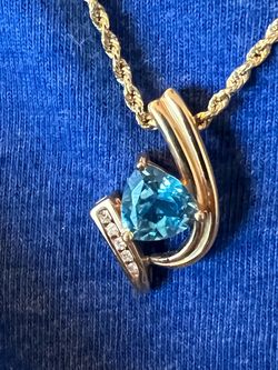 14kt yellow gold 2.5ct Blue topaz 16in necklace and pendant