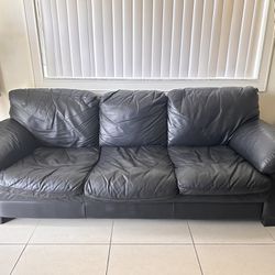 2 black leather sofas for the price of one! 