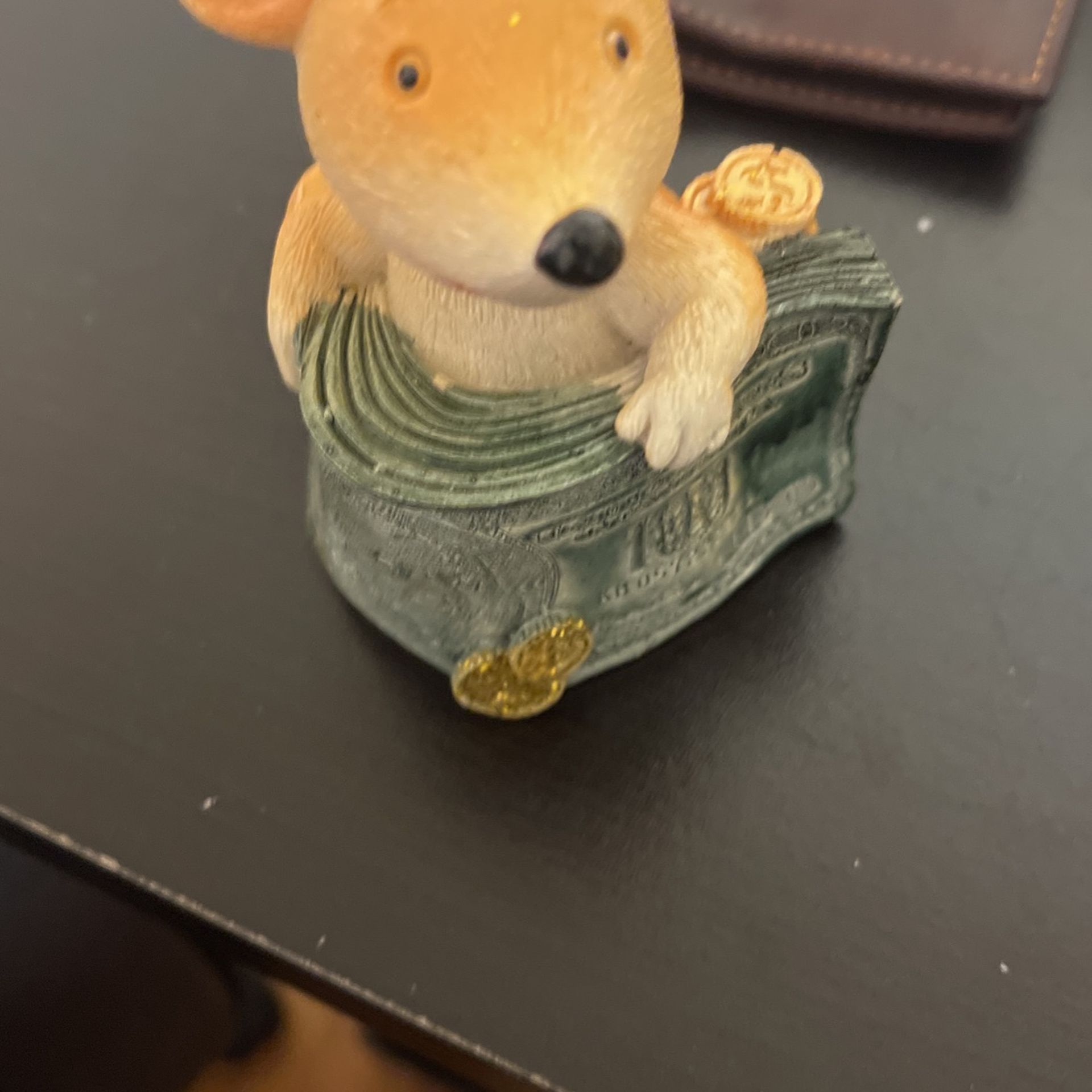 Teddy bear with $100 on it