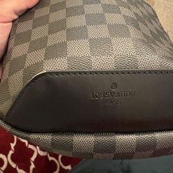 Louis Vuitton Avenue Sling Bag in the Damier Graphite pattern.