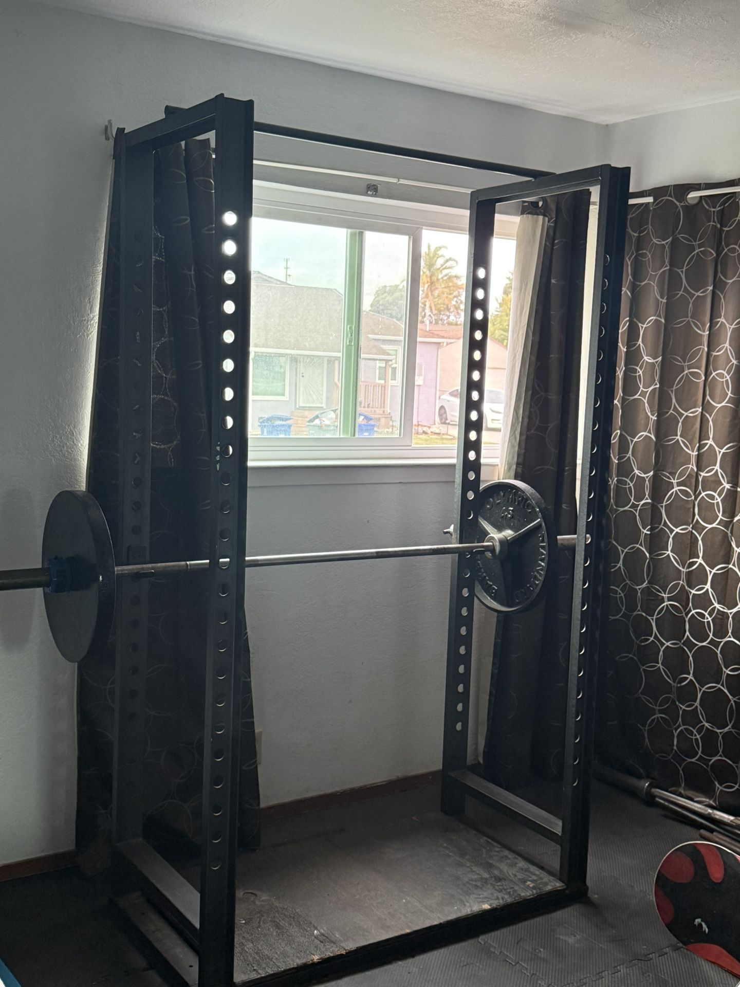 Squat rack with Olympic bar and 2 45lb weights