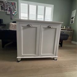 Tilt-out laundry hamper