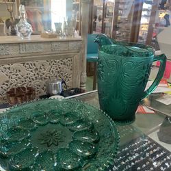 9x10 forest green depression glass pitcher 35.00. 12x12 forest green matching deviled egg platter  25.00.  Johanna at Antiques and More. Located at 31