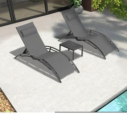Set Of Chaise Lounges And Table