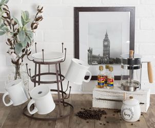 Metal Mug Tree and Plate Rack   Sturdy metal mug tree has a dark brown finish. This three-tier rack features 15 hooks for hanging mugs and a top ring 