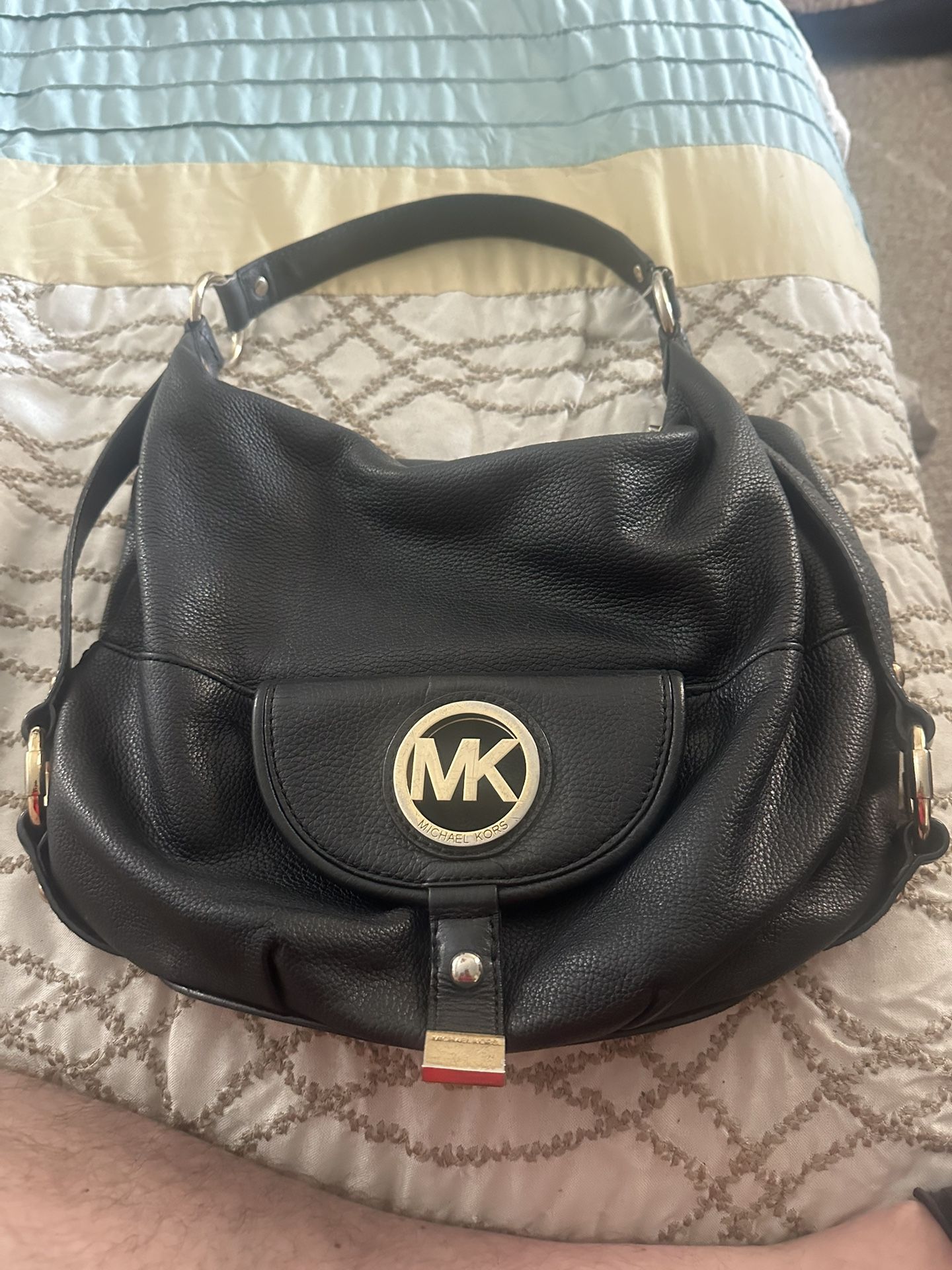 Black Michael Kors woman’s purse