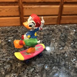 Vintage Disney Donald Duck on A Skateboard.  Made of Rubber / Vinyl.  Year 1988.  Size 4 inches tall and 3 inches wide.  By Bully West Germany/ Europe
