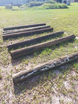 8 ft. X 8" treated wood  fence post. $15.00 each