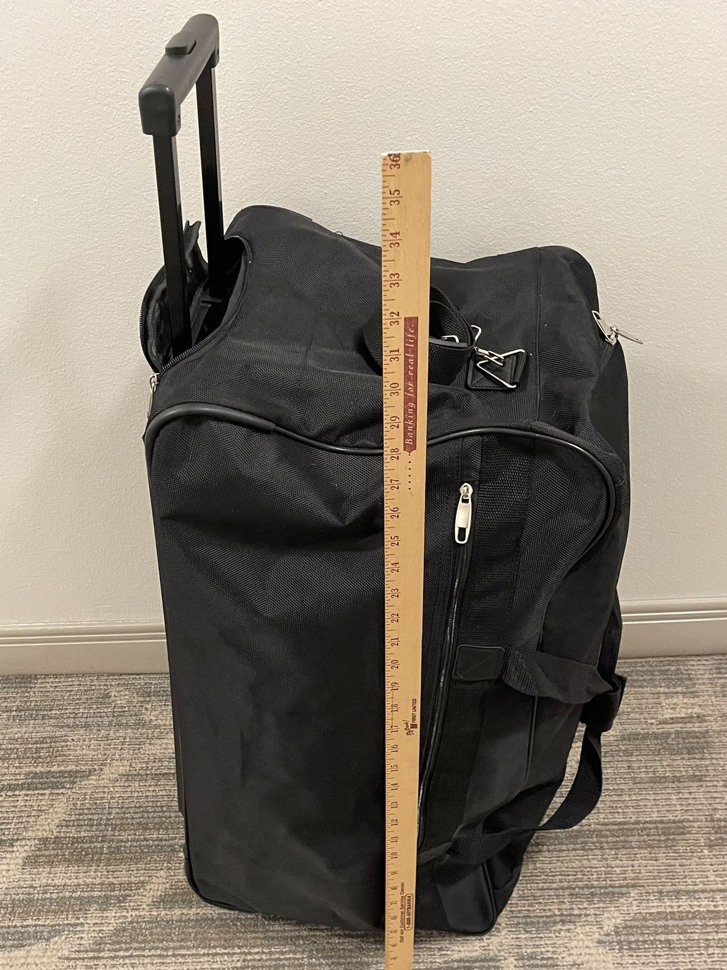 Large (28" x 16" x 10"), Rolling BLACK DUFFEL BAG - posted price is firm.