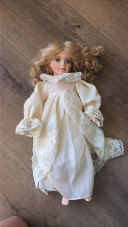 Blond angel porcelain doll