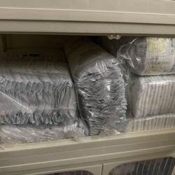 LOTS OF NEWBORN DIAPERS 