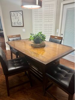 Kitchen table with four chairs and three bar stools