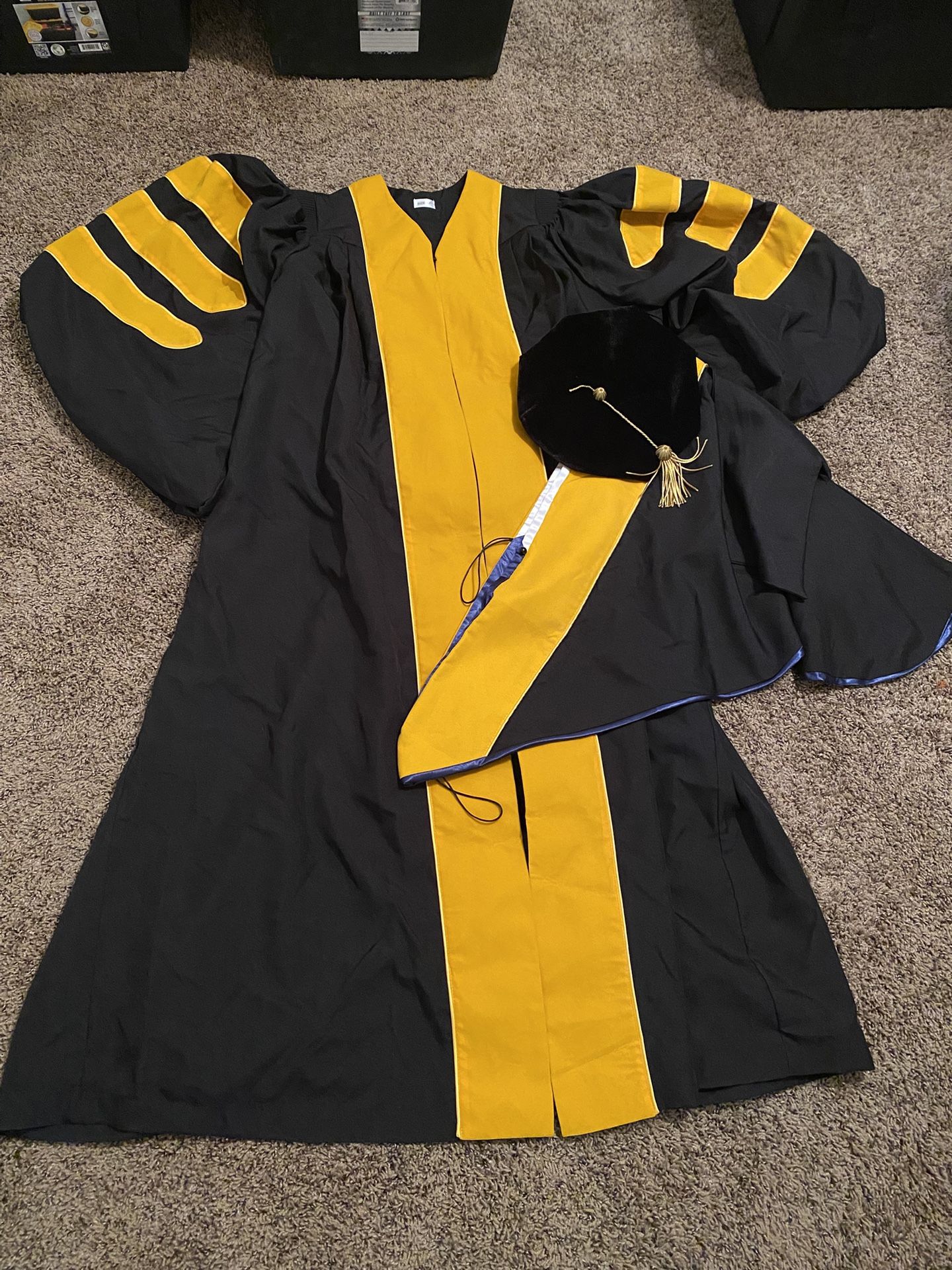 Brand new doctorate gown set. $20. Higley and ray. 