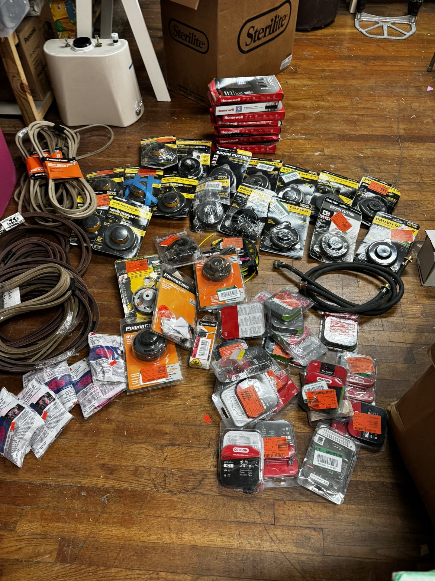 50+ Pieces/Brush cutters,trimmer heads,tractor deck belt, saw chains and particulate filter... 7 Honeywell filters 10 brush cutters ( bladed trimmer