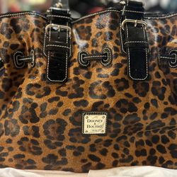 NEW—** $100**-Brand new- Dooney and Bourke Leopard Print Bag with extra Purse. Care bag.