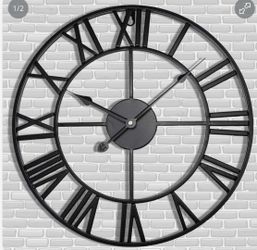 Black 24” Round Metal Clock w/Roman Numerals