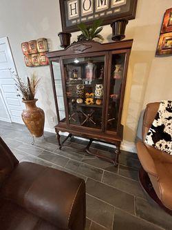 Antique Lighted Curio Cabinet.Beautiful cabinet in great condition! All original. Solid wood, and nice glass.