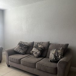 sofa and love seat with pillows like new 