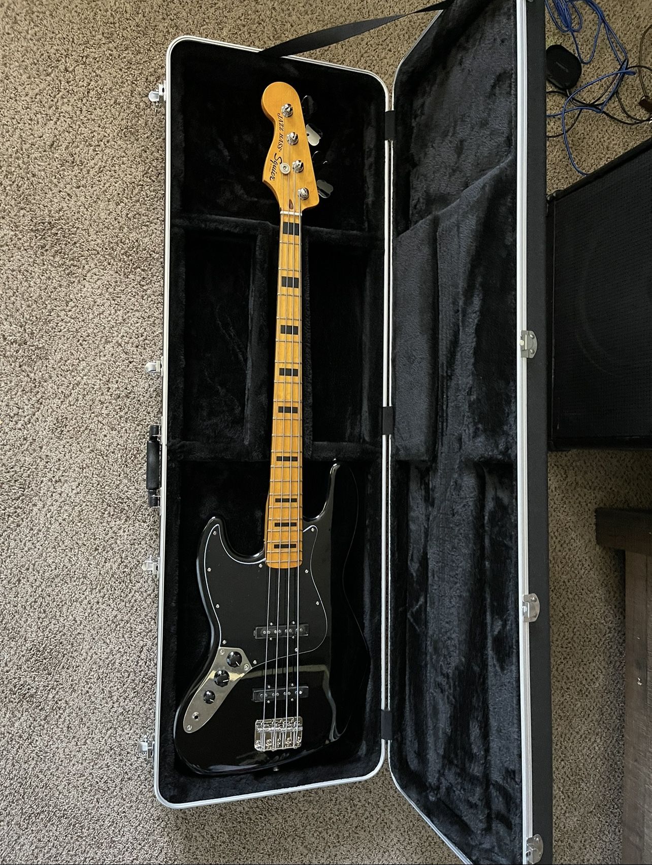 Left handed Squier jazz bass, Ibanez bass amplifier and polytune tuner
