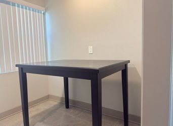 Black wooden counter height dinning table