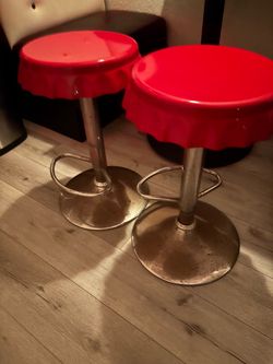 Two red bar stools