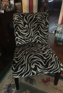 Black in white chair I have 2 for 60 or one for 30 dlrs