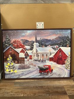 Christmas Snowy village scene with a church and red truck.