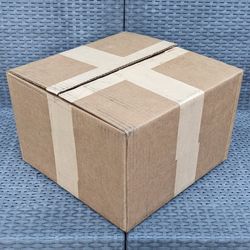 Clean small size cardboard box with foam peanuts for shipping moving or storage