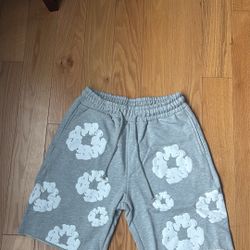 grey and white denim tear shorts