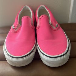 Vans Classic Slip-On sneakers in a neon pink color