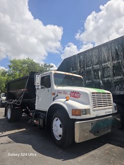 1998 INTERNATIONAL ROLL-OFF TRUCK WITH 12 FT BIN