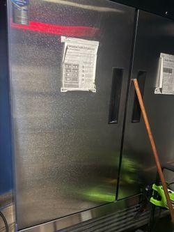 Duckers reach in refrigerator