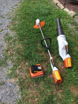 Battery powered string trimmer and blower
