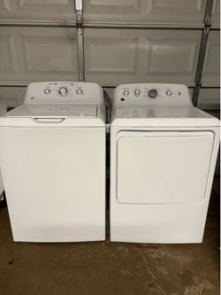GE washer/ dryer set top load . Electric