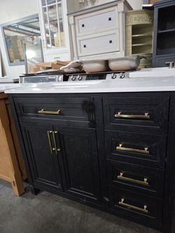 Black Bathroom Vanity with White Countertop and Gold Hardware