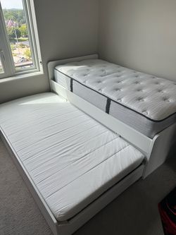 Twin size Ikea double bed with pull out and storage