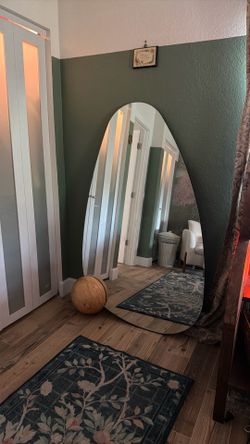 Sculptural organic shape floor mirror