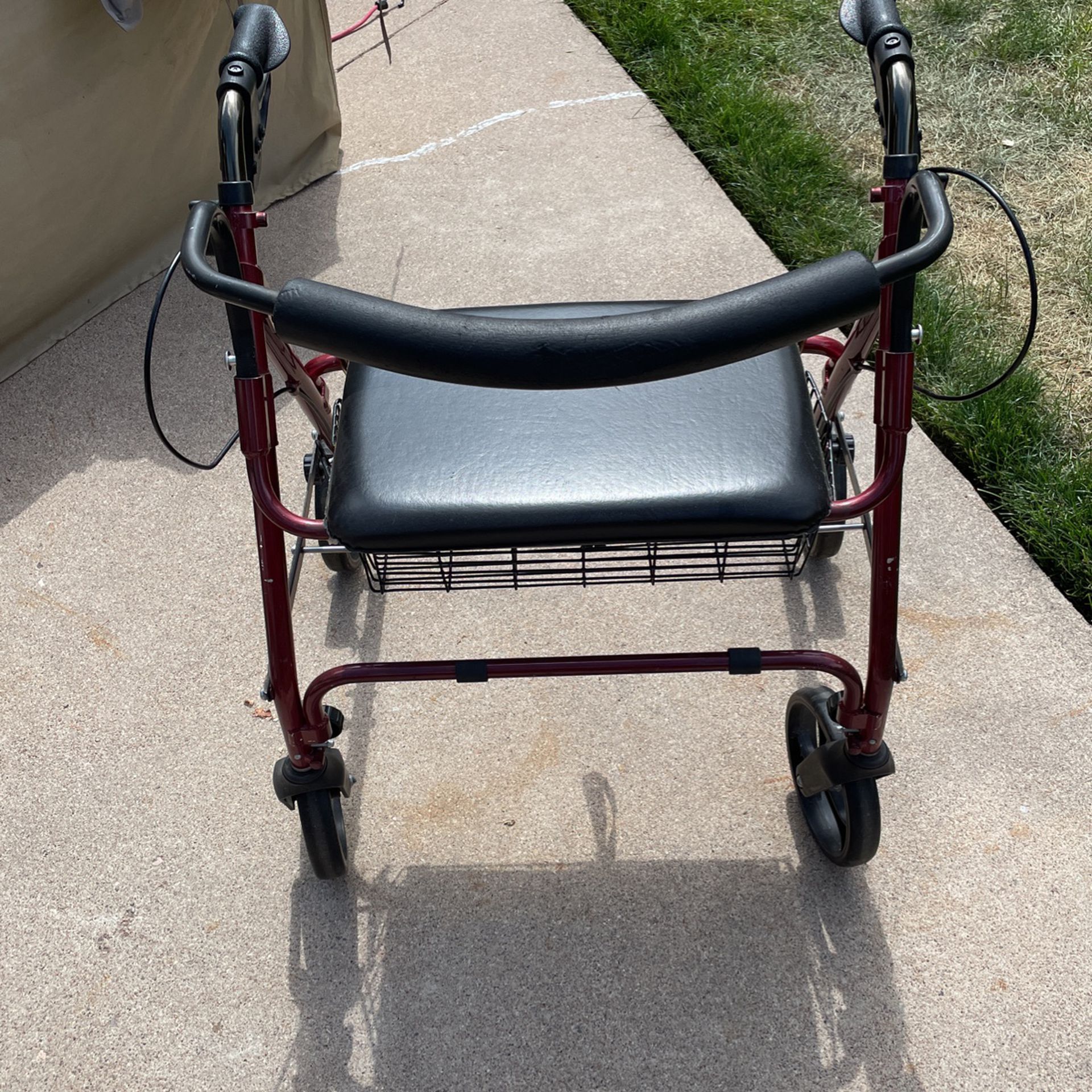 Lightly used Walker with basket and seat