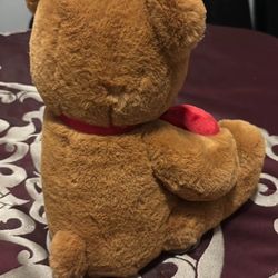 Little bear with red hearts that says I love you
