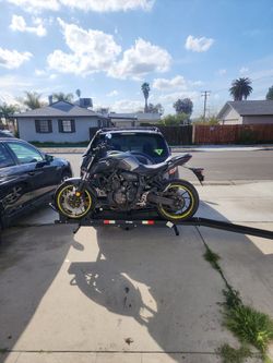 Motorcycle hitch carrier