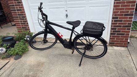 Black Electric Commuter Bike with Rear Rack Bag