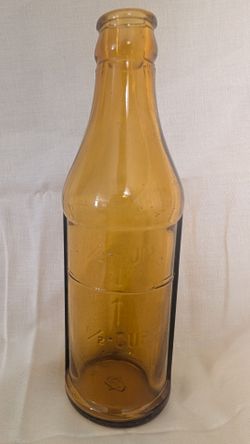 Vintage amber embossed pectin bottle