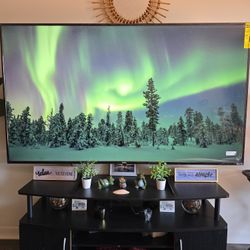 ONN 65” Class 4K UHD Roku Smart TV with Black TV Stand Media Console Curved Front