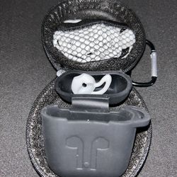 Apple AirPods  silicone case, stored within a zippered carrying case. 