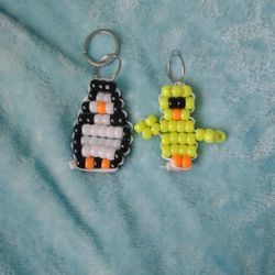 Bird And Penguin Two Different Birds And Used For Keychains Made Out Of Beads