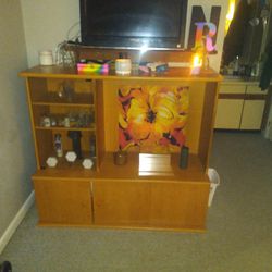 Tv Entertainment Center With Glass Shelving Display And Storage Underneath